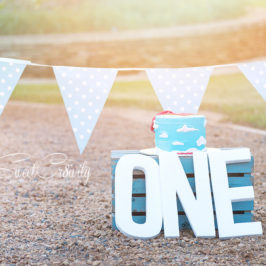 family shoot chris saunders park, umhlanga, durban wedding photographers, sweetcr8ivity, cakes smash, superman theme, birthday cake, trisha and wayne,parklane,polka dot bunting, superman cape, onesie