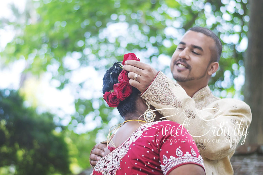 1 year wedding anniversary,durban botanical gardens,durban wedding photographers,red sari,sweetcr8ivity,elaine and aveen lutchman,will always be the 1 white rose amongst the red ones,love story,happiness,laughter,fun,creative,ring shot,couple goals,he always makes her smile,lace umbrella,creative photo shoot