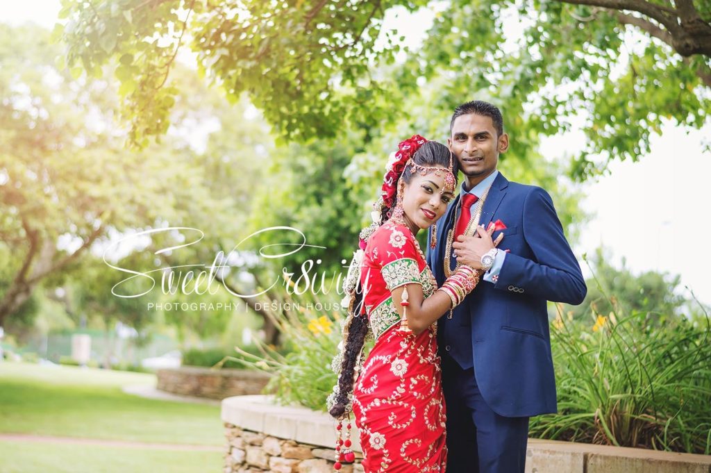 tamil wedding,chris saunders park creative shoot,bridal couple,durban wedding photographers,umhlanga,red bridal sari,long south indian plait,shree emperumal temple hall mt edgecombe,red and white roses,mala,thali,rings,prevern and lushal,elaine and aveen lutchman,toe rings,beautiful bride,love,wedding photographers durban
